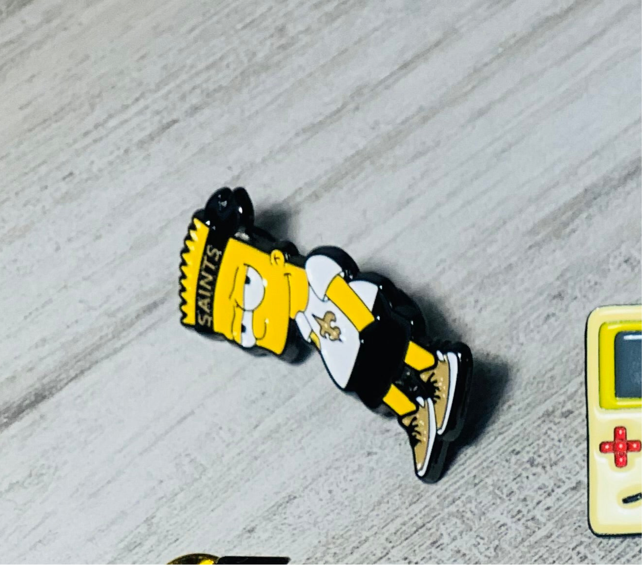Bart Simpson Saints Enamel Pin – Streetwear Cartoon Collectible
